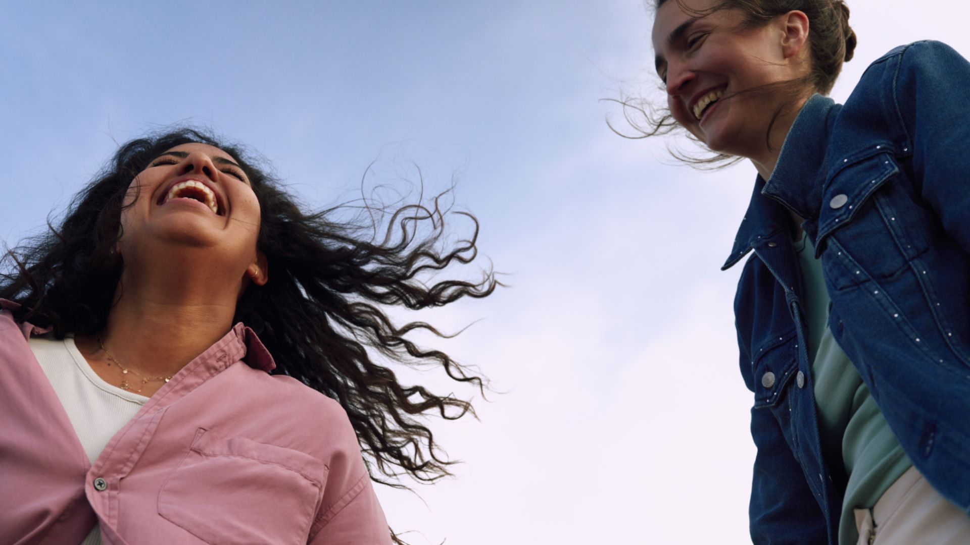 Decorative image of two women laughing and spending time together