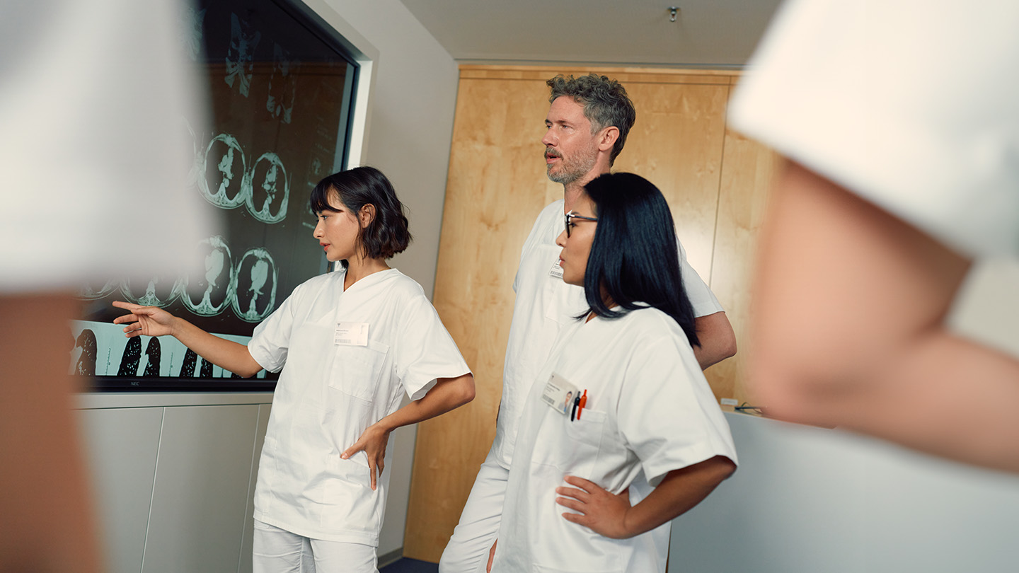 Doctor showing scan to a patient